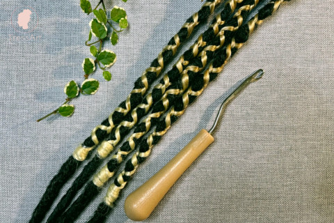 Braiding in single-ended synthetic dreadlock with fishtailstich