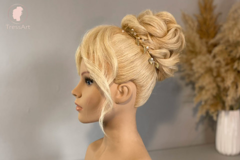 High bun with curtain bangs